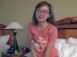 Charming busty asian teenager fngers in glasses